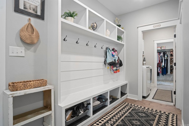 mudroom featuring hardwood / wood-style flooring and washer / clothes dryer