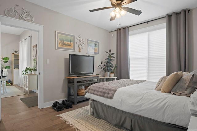 bedroom featuring ceiling fan and hardwood / wood-style floors