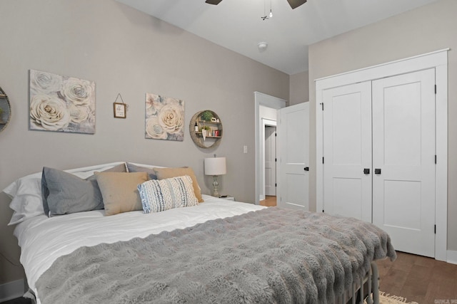 bedroom with hardwood / wood-style floors, a closet, and ceiling fan