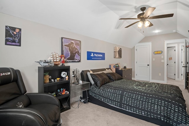 carpeted bedroom with vaulted ceiling and ceiling fan