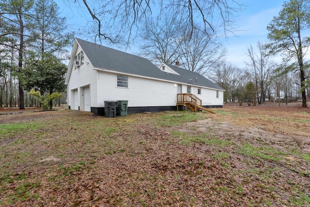 view of side of property with a garage