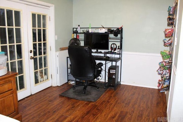 home office with dark hardwood / wood-style flooring and french doors