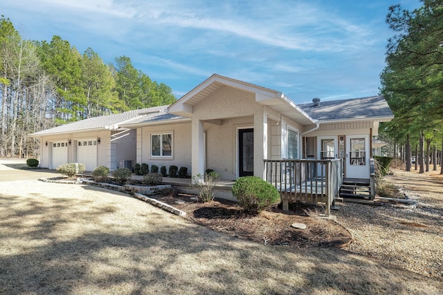 view of front of house with a garage and covered porch