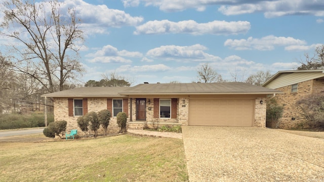 ranch-style house with a garage and a front lawn