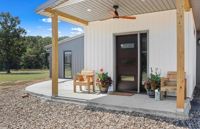 property entrance with a patio and ceiling fan