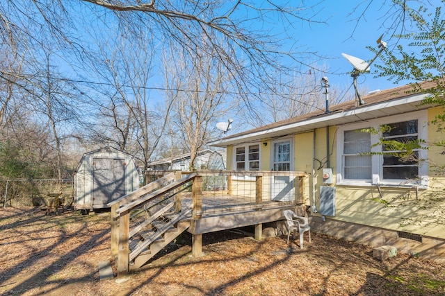 exterior space with a deck and a shed