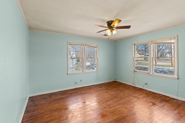 unfurnished room featuring ceiling fan, ornamental molding, and wood-type flooring