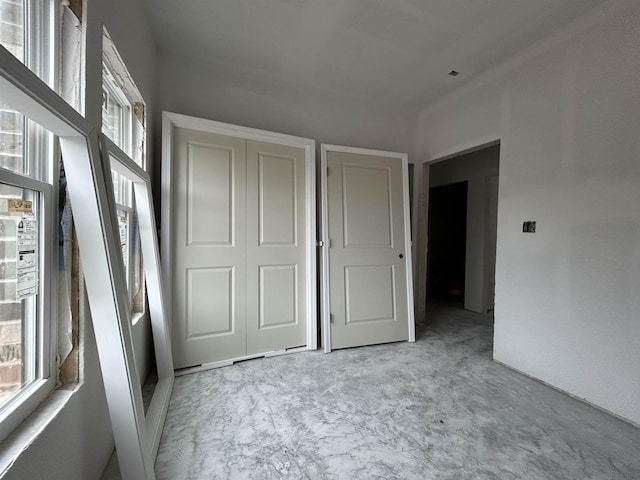 unfurnished bedroom featuring a closet