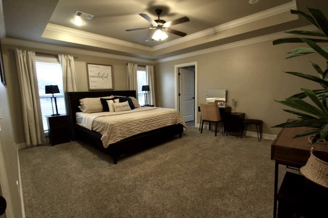 bedroom with a raised ceiling, crown molding, carpet, and ceiling fan