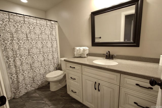 bathroom featuring vanity and toilet