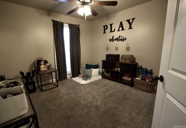 playroom featuring ceiling fan and carpet floors