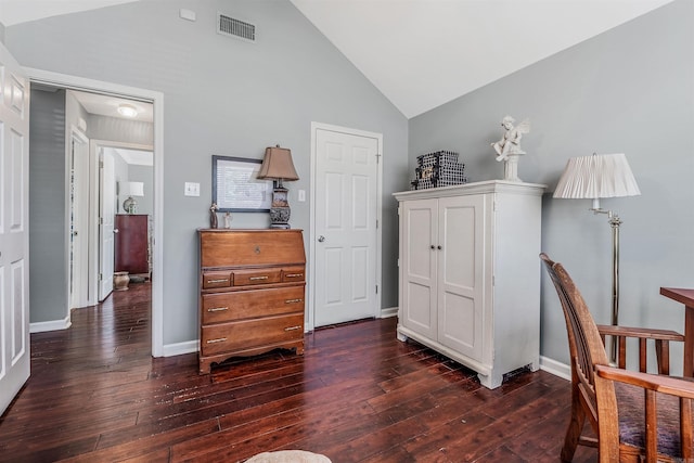 bedroom featuring dark hardwood / wood-style flooring and high vaulted ceiling