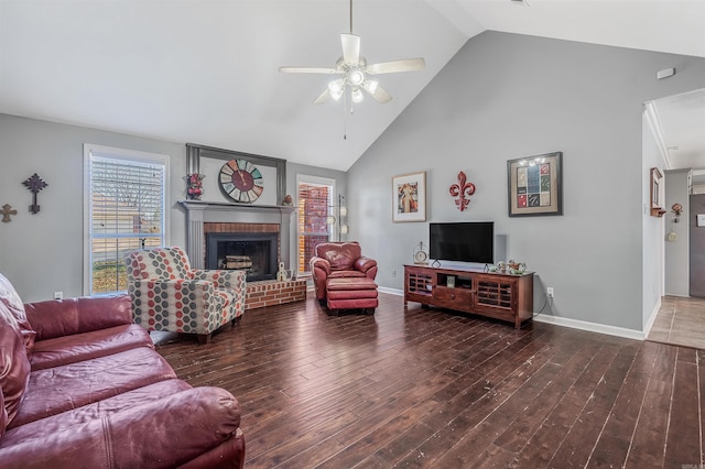 living room with ceiling fan, a fireplace, dark hardwood / wood-style floors, and high vaulted ceiling