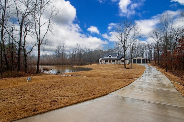 exterior space with a water view and a garage