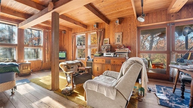 sitting room with hardwood / wood-style flooring, a healthy amount of sunlight, and wooden ceiling