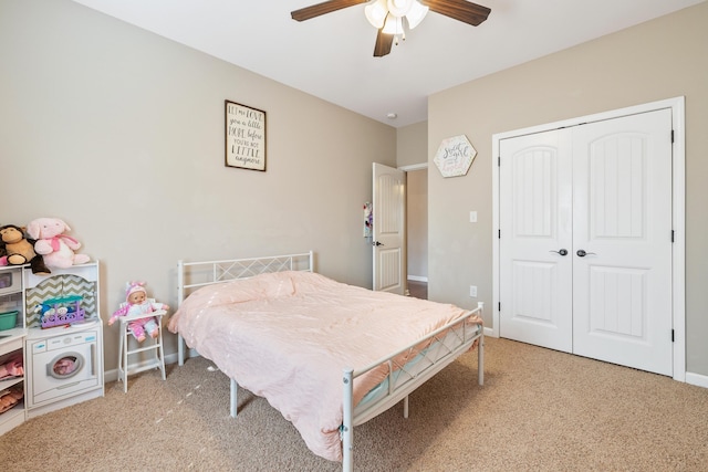 bedroom with ceiling fan, carpet, and a closet