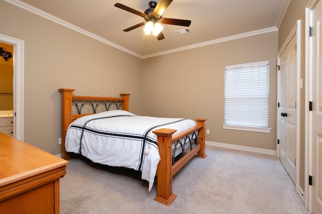 carpeted bedroom featuring crown molding, ceiling fan, and ensuite bathroom