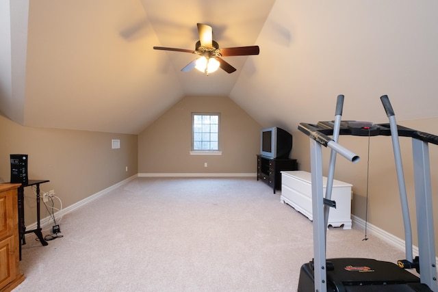 exercise room featuring ceiling fan, lofted ceiling, and light carpet