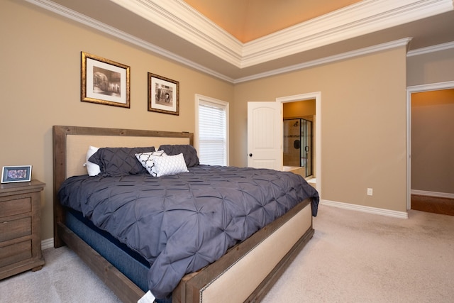 carpeted bedroom with ornamental molding and ensuite bathroom