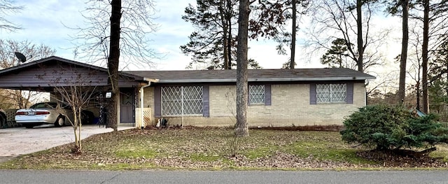 single story home with a carport