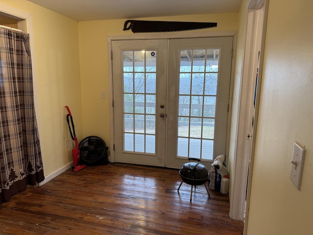 doorway with dark hardwood / wood-style flooring and french doors