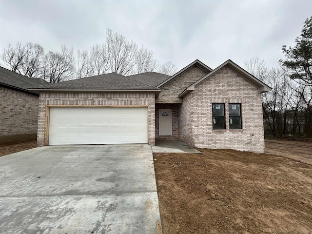 view of front of property featuring a garage