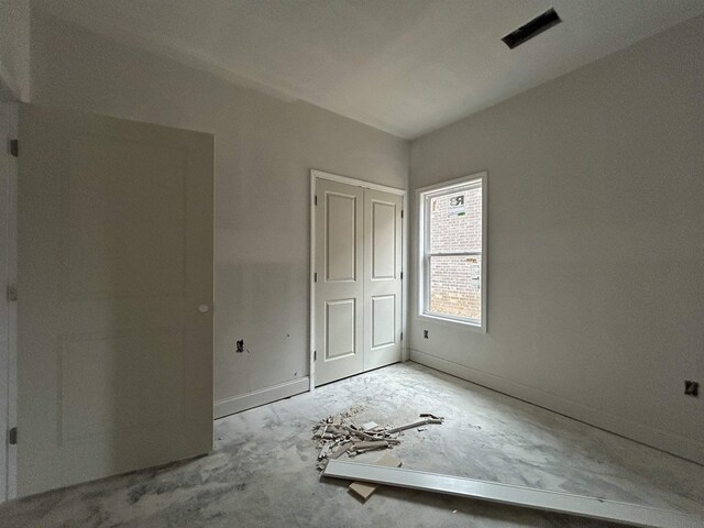 unfurnished bedroom with a closet