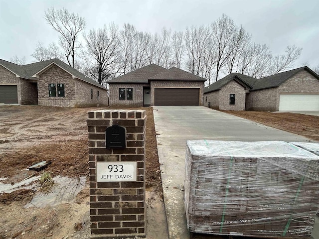 view of front facade with an outbuilding and a garage