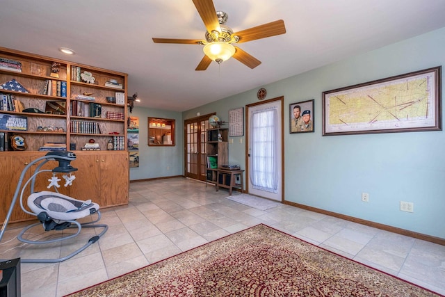 unfurnished room featuring light tile patterned floors and ceiling fan