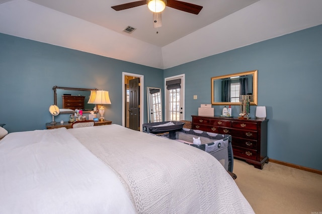 bedroom with ceiling fan, lofted ceiling, and light carpet