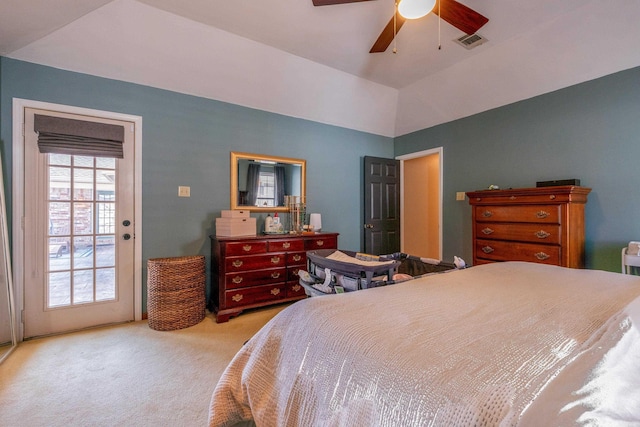 bedroom with ceiling fan, light colored carpet, and vaulted ceiling