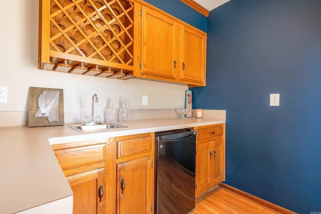 kitchen with light hardwood / wood-style floors, refrigerator, sink, and dishwasher