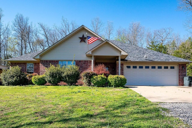 view of front of home with a garage and a front lawn