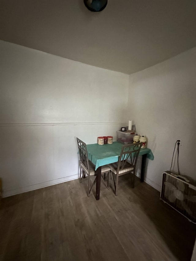 dining room with dark hardwood / wood-style floors