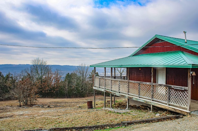 view of side of home featuring a mountain view