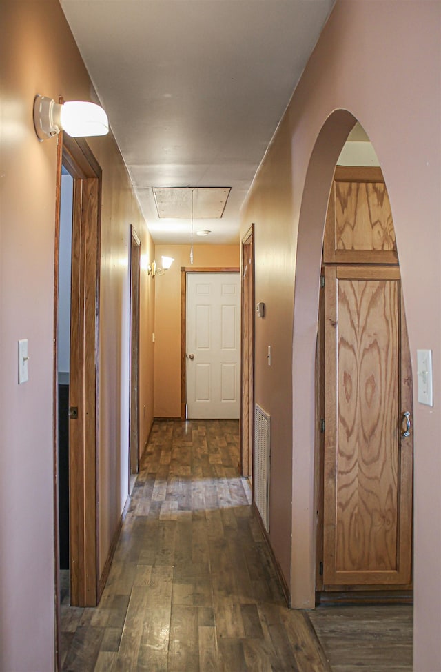 corridor featuring dark hardwood / wood-style flooring