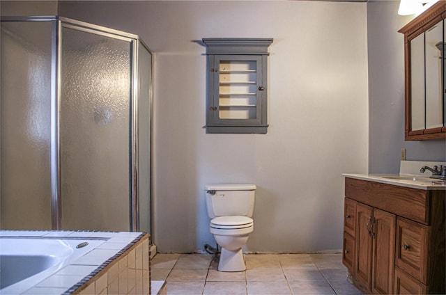 full bathroom featuring tile patterned flooring, vanity, plus walk in shower, and toilet