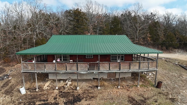 back of house with a wooden deck