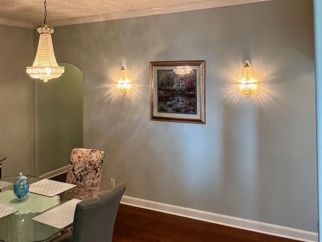 unfurnished dining area featuring hardwood / wood-style floors and crown molding