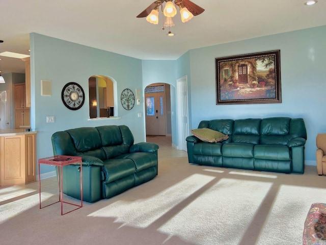 living room with ceiling fan and light carpet