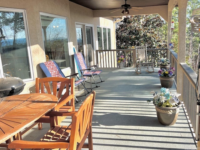 exterior space with ceiling fan