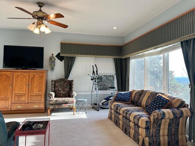 living room with light colored carpet and ceiling fan