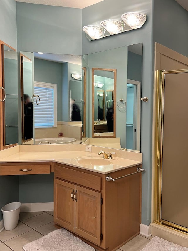 bathroom featuring tile patterned floors, vanity, and an enclosed shower