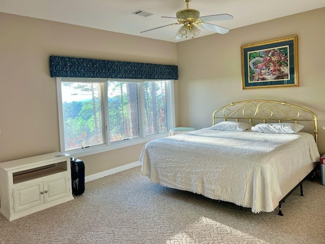 bedroom with light carpet and ceiling fan