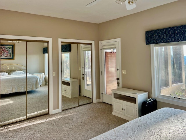 carpeted bedroom with two closets