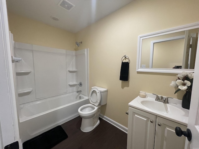 full bathroom with vanity, hardwood / wood-style flooring, shower / tub combination, and toilet