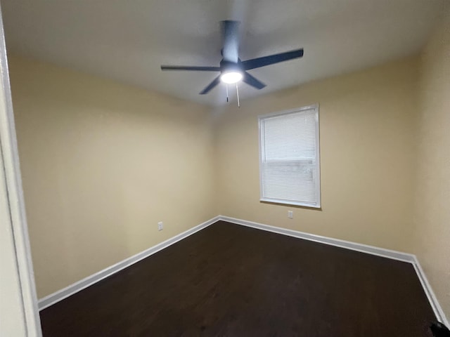 spare room with hardwood / wood-style flooring and ceiling fan