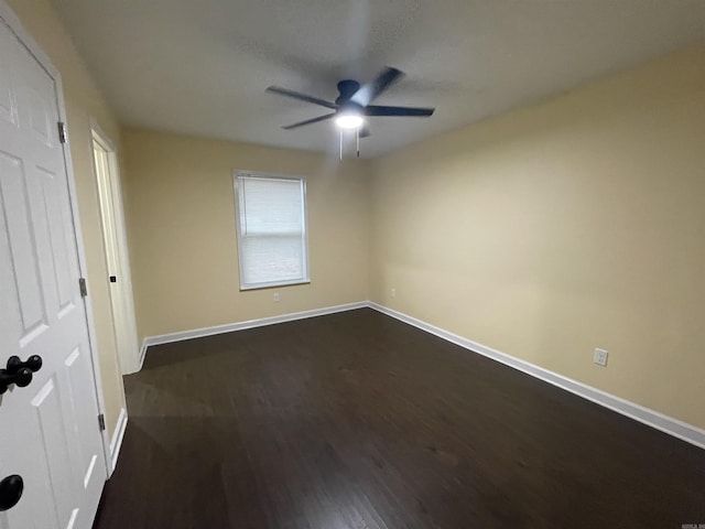 unfurnished bedroom with dark hardwood / wood-style floors and ceiling fan