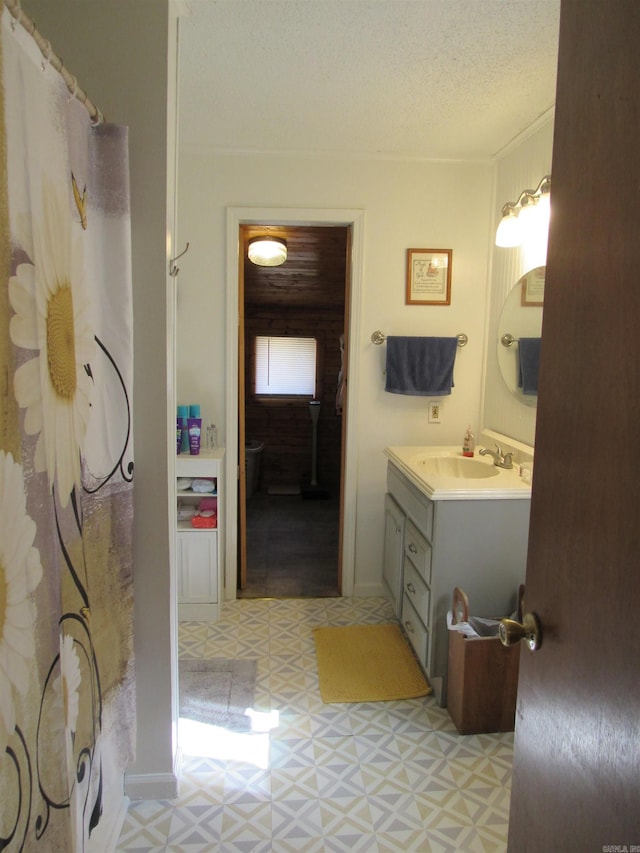 bathroom with vanity and a textured ceiling