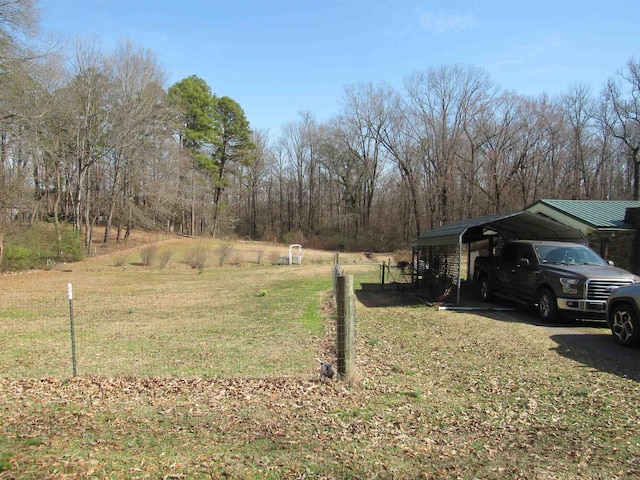 view of yard with a carport